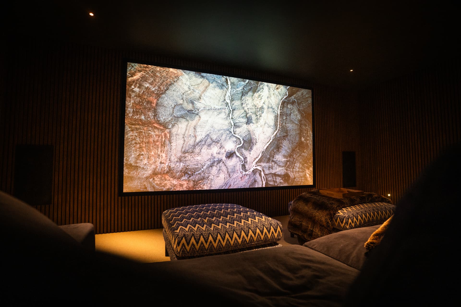 Completed private cinema in Surrey with integrated projection and acoustic wall treatment