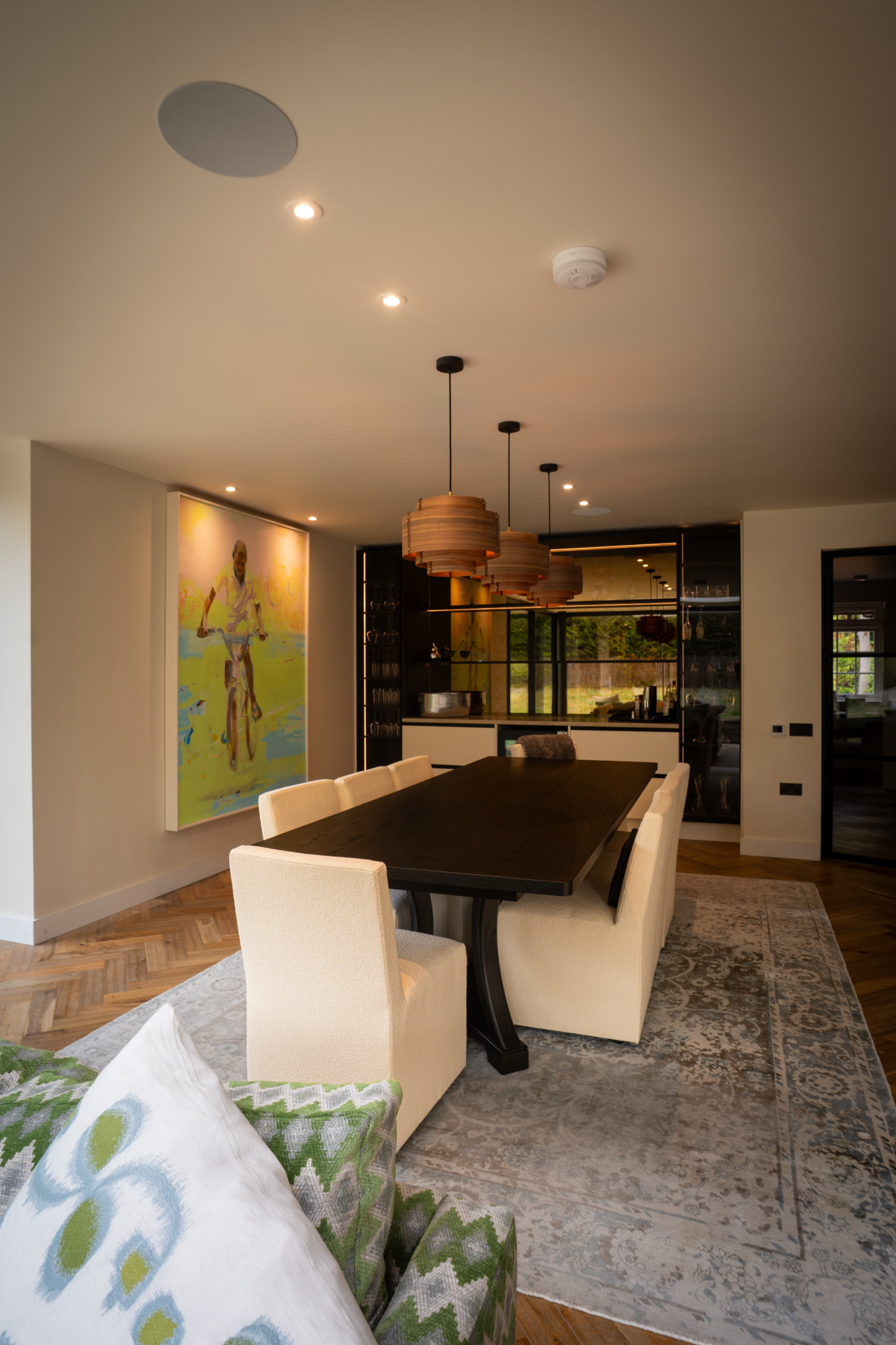 Dining room with pendant lighting controlled by the Surrey system