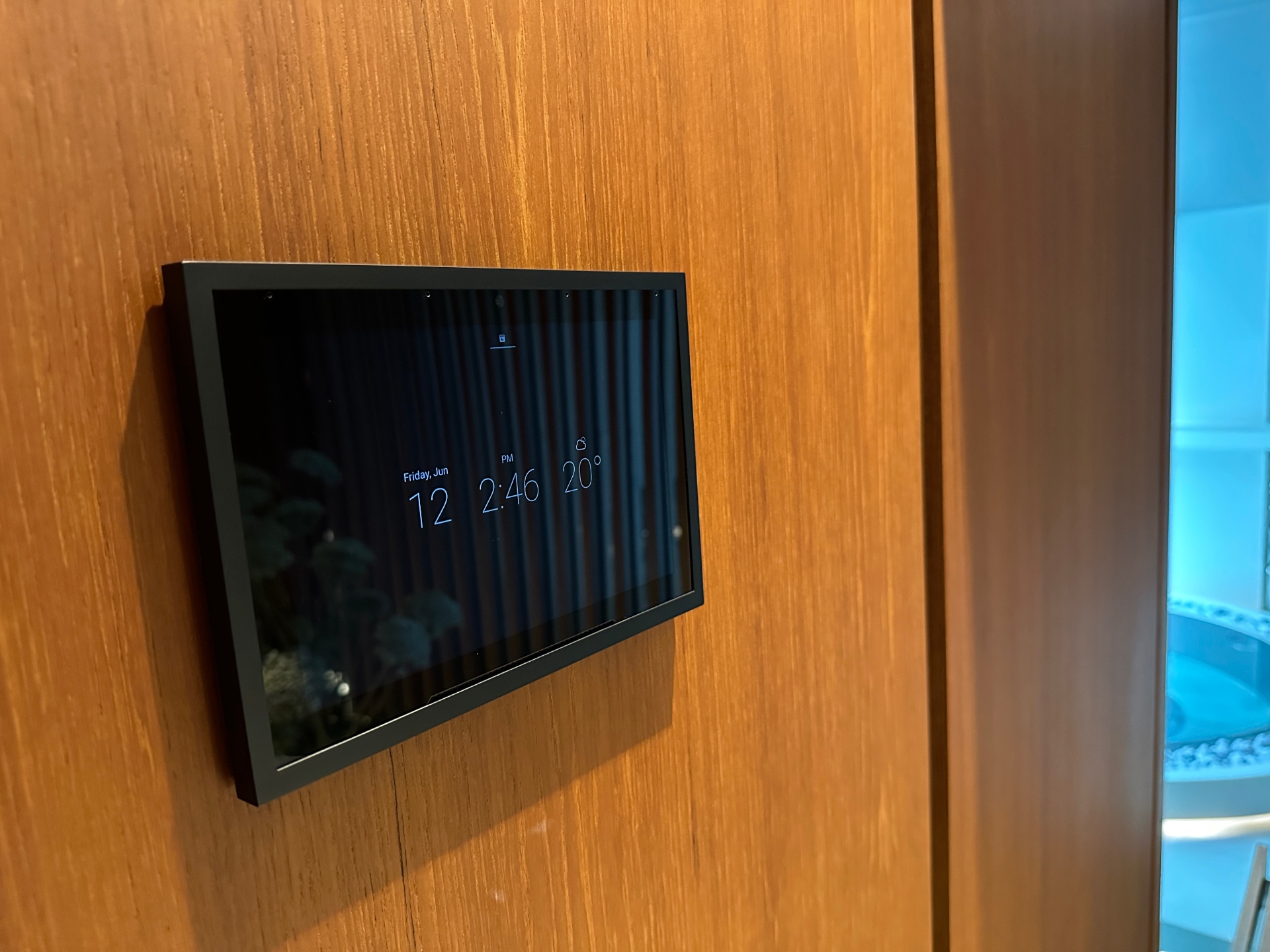 Control4 T5 touch screen set into timber joinery at the private London residence
