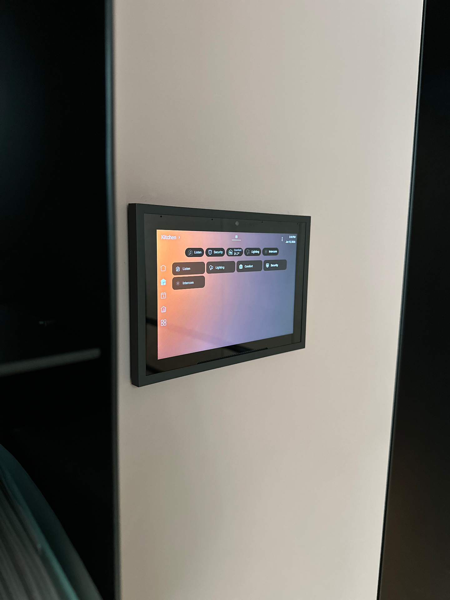 Control4 T5 touch screen on the kitchen wall at the private London residence